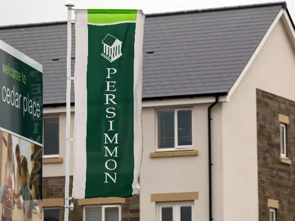 Persimmon shares rise despite profits slump